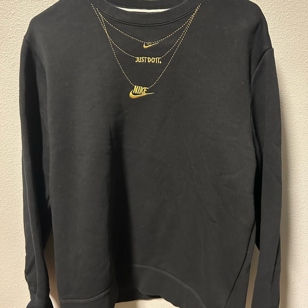 Nike women’s Black sweatshirt with Gold Details. Size small. Very soft and cozy